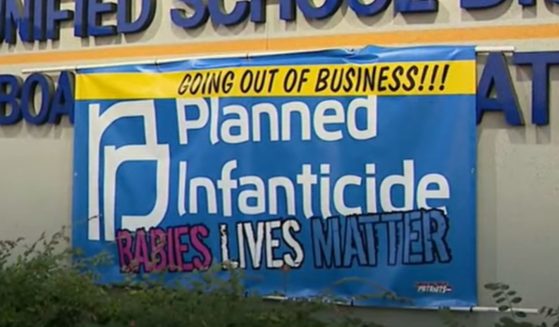Pro-life parents posted a sign in opposition to a Planned Parenthood clinic at John Glenn High School in the Norwalk-La Mirada Unified School District in Los Angeles.