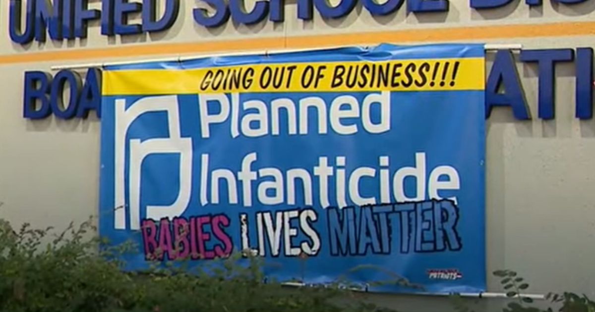Pro-life parents posted a sign in opposition to a Planned Parenthood clinic at John Glenn High School in the Norwalk-La Mirada Unified School District in Los Angeles.