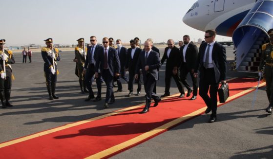 Russian President Vladimir Putin walks on the red carpet after leaving his presidential plane during the welcoming ceremony at the airport in Tehran on Tuesday.