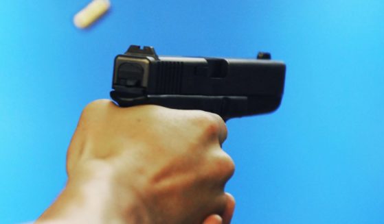 A man shoots a handgun at the Project Y2000 firing range in El Cajon, California, on April 21, 2009.