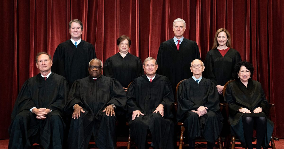 The Supreme Court justices pose during a group photo in Washington, D.C., on April 23, 2021.