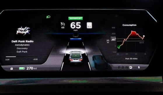 The new dashboard of Tesla electric sedan is seen on a giant screen during Elon Musk's unveiling of the dual-engine chassis of the new Tesla 'D' model.