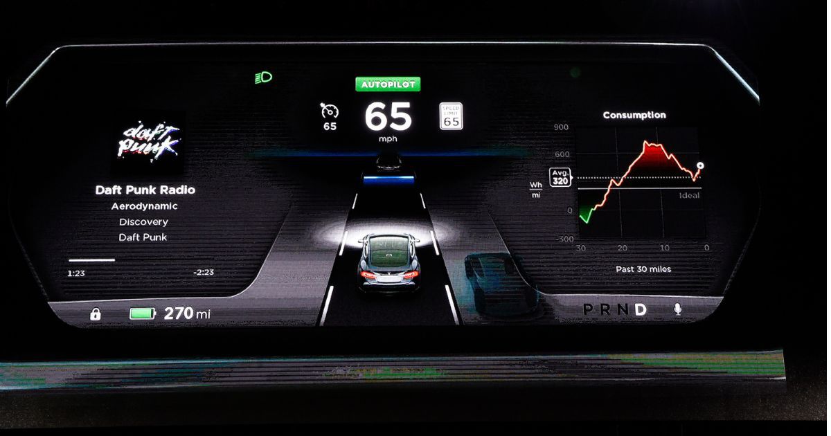 The new dashboard of Tesla electric sedan is seen on a giant screen during Elon Musk's unveiling of the dual-engine chassis of the new Tesla 'D' model.