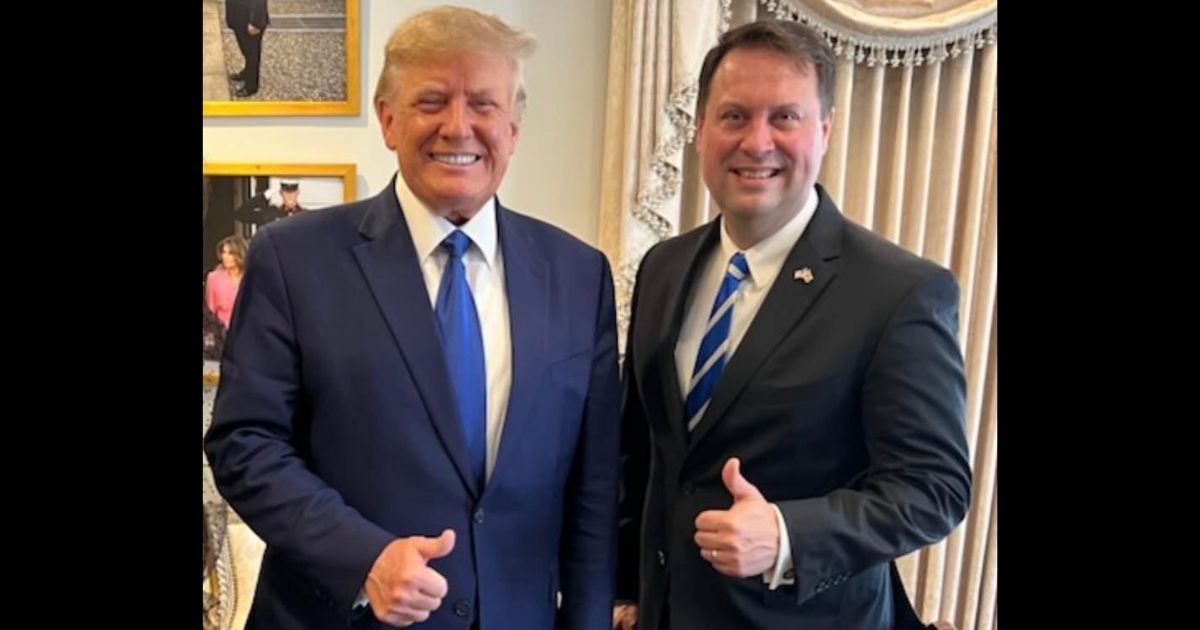 Former President Donald Trump poses with Maryland GOP gubernatorial candidate Dan Cox.