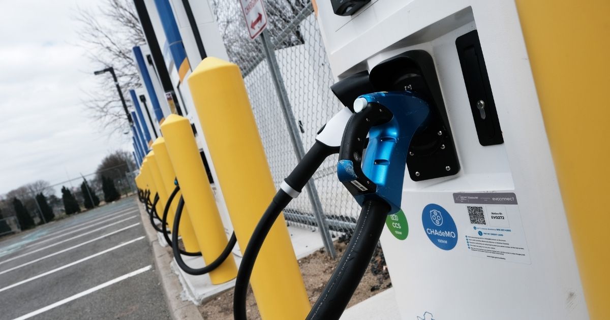 A row of fast-charging stations for electric vehicles is pictured near New York's John F. Kennedy airport in April 2021.