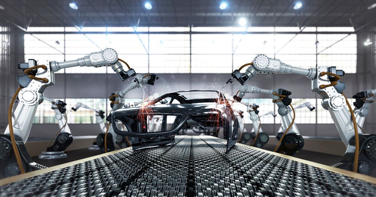 A robotic arm welds a car in an automobile manufacturing plant in this stock photo. In Luverne, Alabama, Hyundai supplier SMART Alabama reportedly used child labor at its plant.