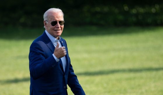 President Joe Biden gives a thumbs up to reporters at the White House last week, before it was known that he'd contracted COVID-19.