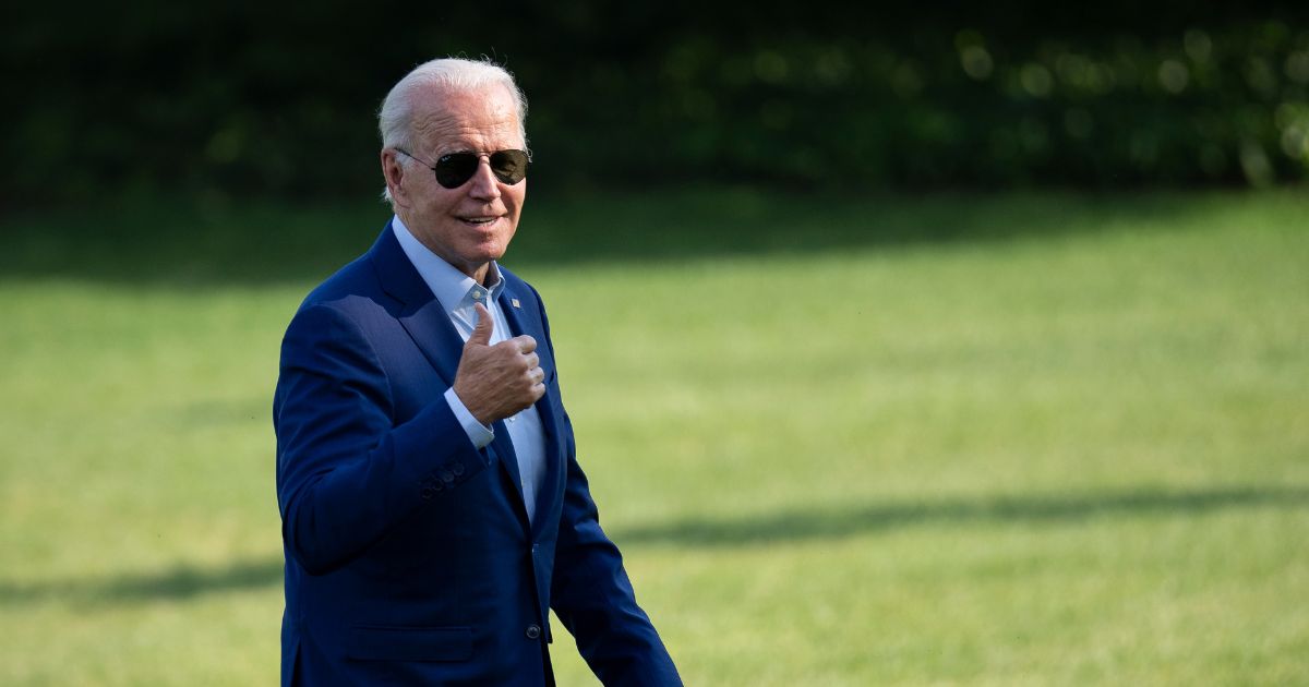 President Joe Biden gives a thumbs up to reporters at the White House last week, before it was known that he'd contracted COVID-19.