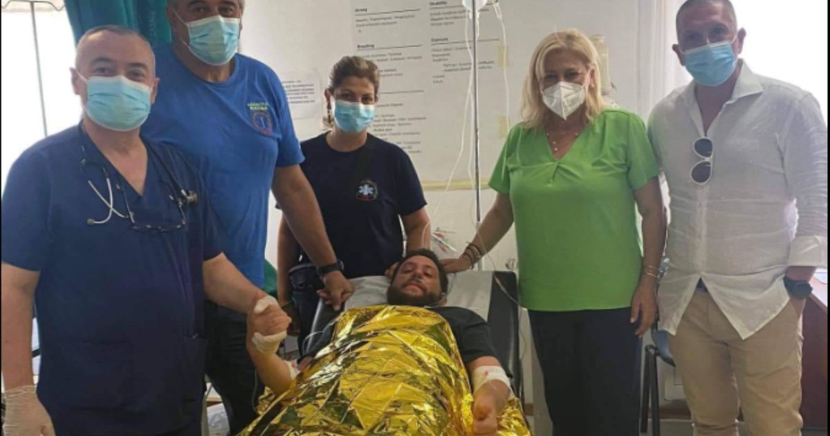 A man named Ivan, whose last name was not released, recovers in a hospital after spending 18 hours afloat at sea after he was swept out by powerful currents.
