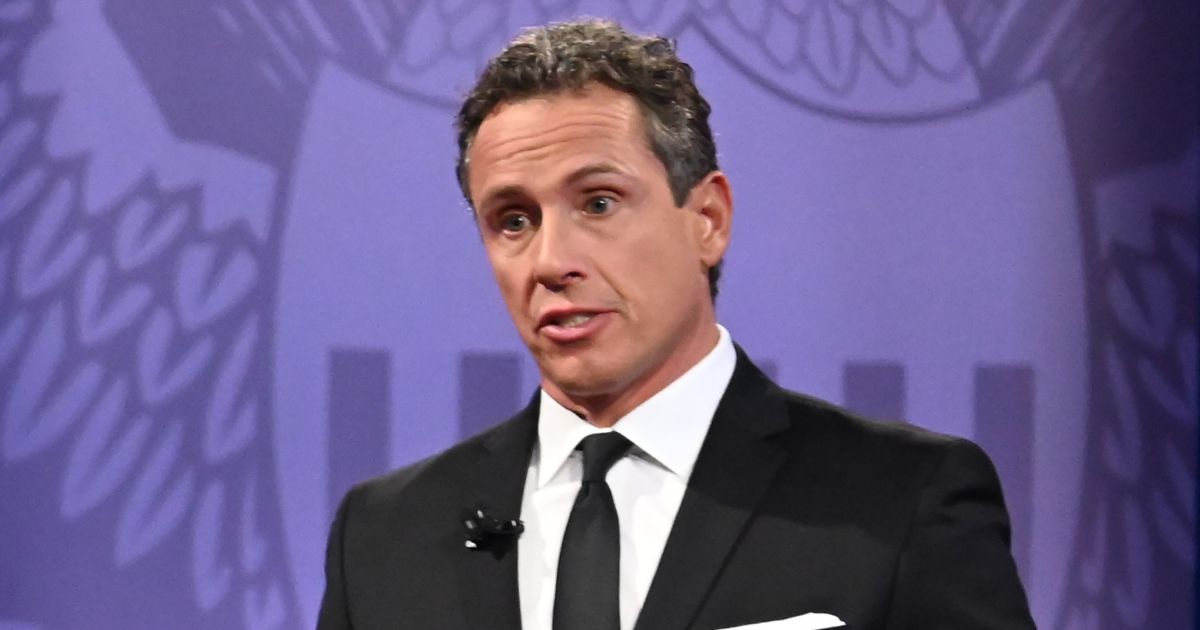 Then-CNN moderator Chris Cuomo stands onstage during a town hall for Democratic presidential candidates in Los Angeles on Oct. 10, 2019.