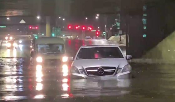 Cars in Las Vegas stalled as underpasses filled with floodwaters Thursday.