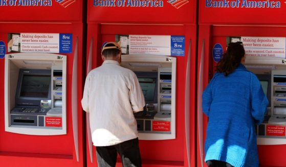 Customers use ATM machines at a Bank of America branch office April 21, 2008, in San Francisco, California.