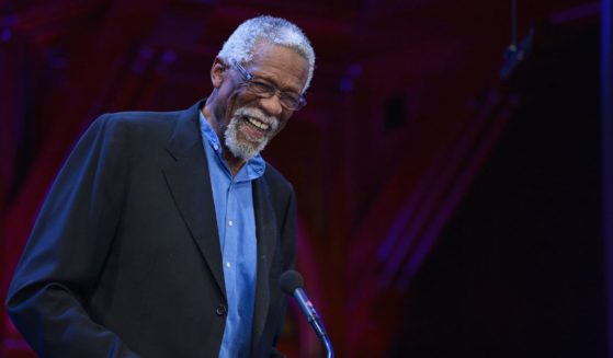 Former Boston Celtic and NBA Hall of Famer Bill Russell presents the 2013 W.E.B. Du Bois Medal to NBA Commissioner David Stern at a ceremony at Harvard University's Sanders Theatre on Oct. 2, 2013, in Cambridge, Massachusetts.