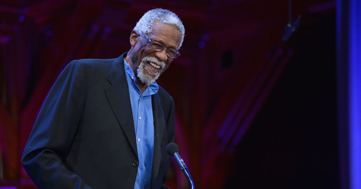 Former Boston Celtic and NBA Hall of Famer Bill Russell presents the 2013 W.E.B. Du Bois Medal to NBA Commissioner David Stern at a ceremony at Harvard University's Sanders Theatre on Oct. 2, 2013, in Cambridge, Massachusetts.