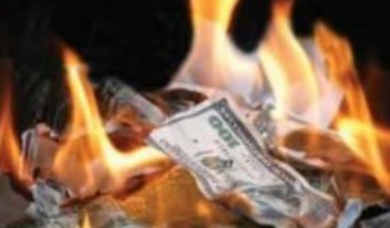 American dollar bills are burning in this image.