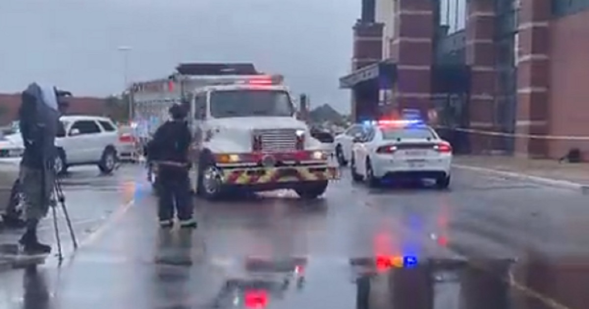 Emergency vehicles arrive at the scene of Sunday's mall shooting in Greenwood, Indiana.