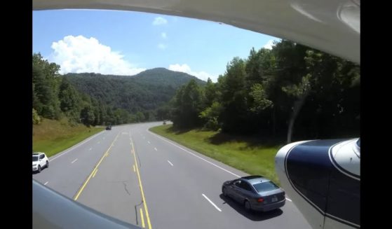 A plane makes an emergency landing on a highway in western North Carolina on Sunday.
