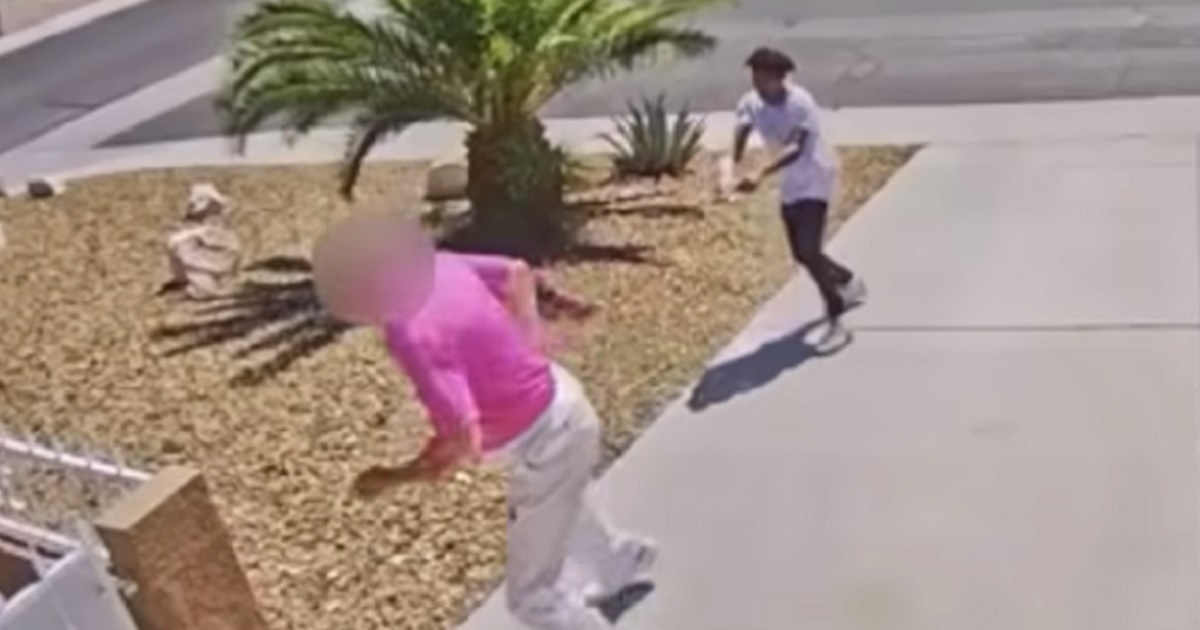 A Las Vegas homeowner is chased by a gunman Sunday in a still taken from a doorbell camera video.