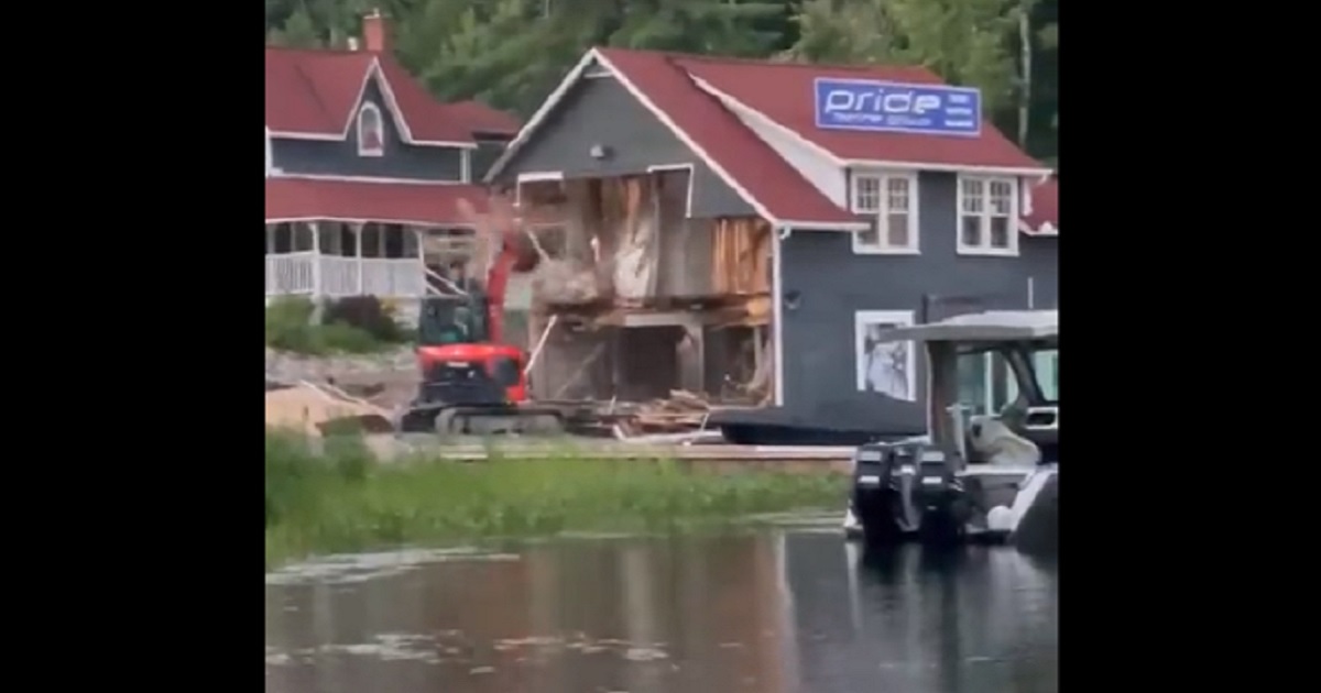 An excavator tears up a marina in an affluent resort in Ontario, Canada.