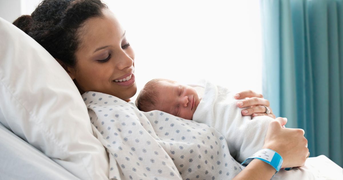 In the above stock image, a mother holds her newborn.