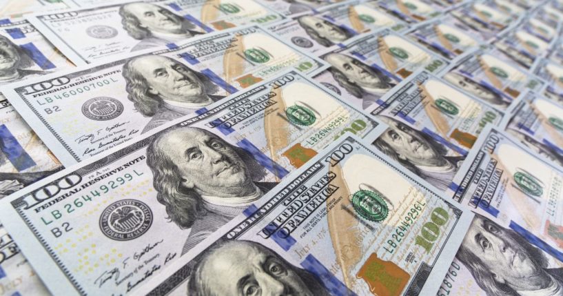 $100 bills are seen in this stock image.
