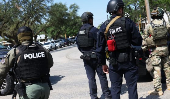 Law enforcement officials prepare for the arrival of President Joe Biden's attendance for mass at Sacred Heart Catholic Church on May 29, in Uvalde, Texas.