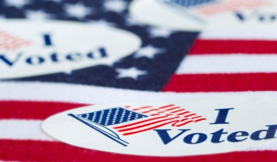 Stickers saying "I Voted" are seen in the above stock image.