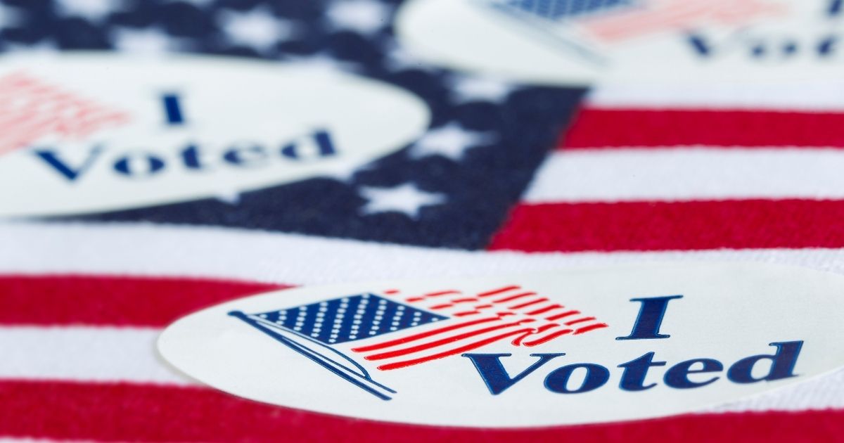 Stickers saying "I Voted" are seen in the above stock image.
