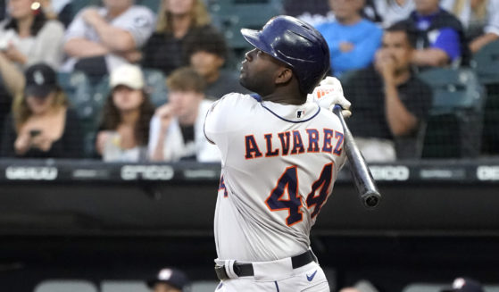 The Houston Astros' Yordan Alvarez watches his sacrifice fly off Chicago White Sox starting pitcher Johnny Cueto during the first inning of a game on Monday in Chicago.