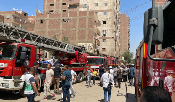 Firefighters and first responders work at the site of the Abu Sefein church fire in Cairo, Egypt, which left at least 41 dead, on Sunday.