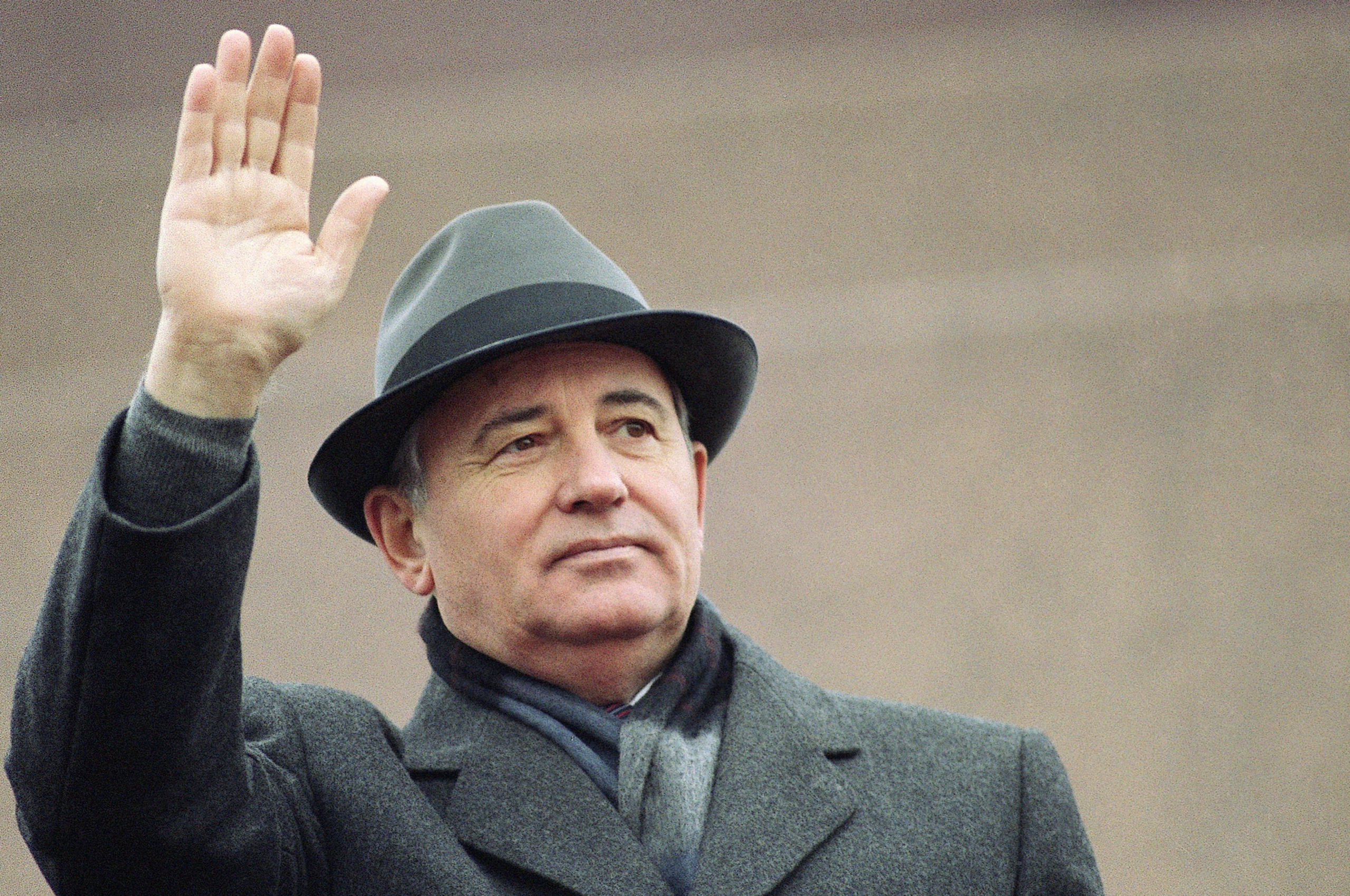 Soviet President Mikhail Gorbachev waves from the Red Square tribune during a Revolution Day celebration, in Moscow, Soviet Union, in a file photo from November 1989. Russian news agencies are reporting that former Gorbachev has died at 91.