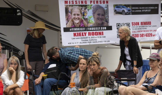 On Aug. 9, law enforcement officials give a news conference on missing 16-year-old Kiely Rodni, while her mother Lindsey Rodni-Nieman, center, listens.
