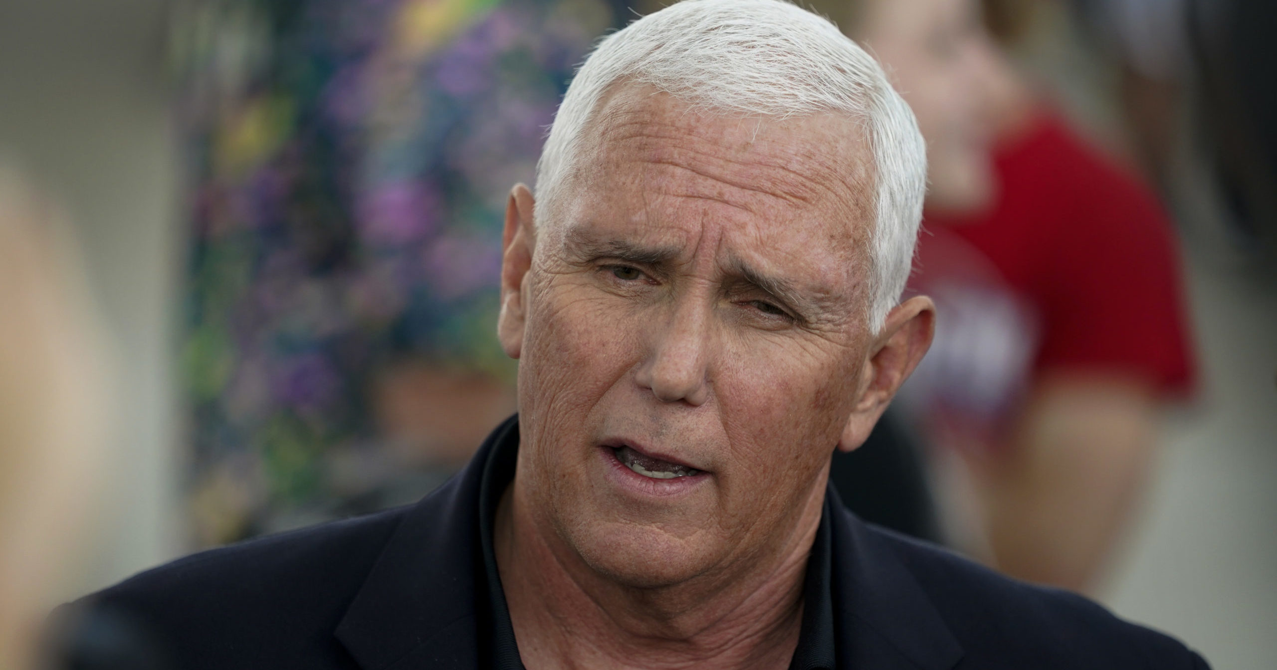 Former Vice President Mike Pence speaks to reporters during a visit to the Iowa State Fair on Friday in Des Moines, Iowa.