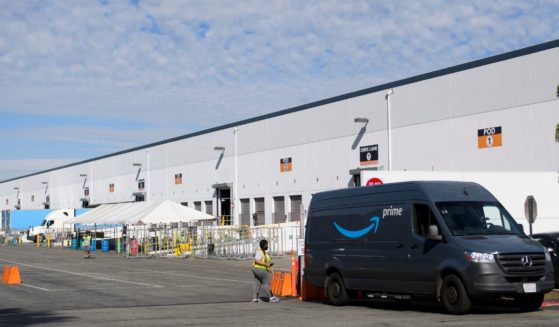 An Amazon delivery van sits outside a distribution facility in Hawthorne, California, on Feb. 2, 2021.