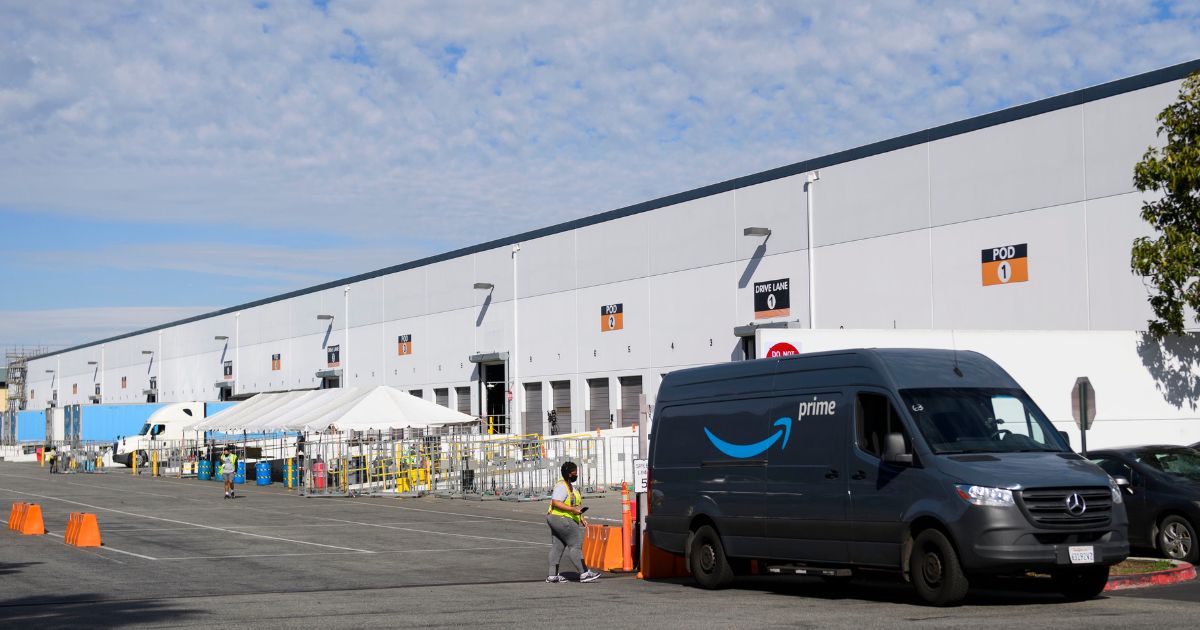 An Amazon delivery van sits outside a distribution facility in Hawthorne, California, on Feb. 2, 2021.