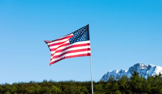 An American flag flies in this stock image.