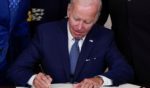 President Joe Biden signs the Inflation Reduction Act in Washington, D.C., on Tuesday.