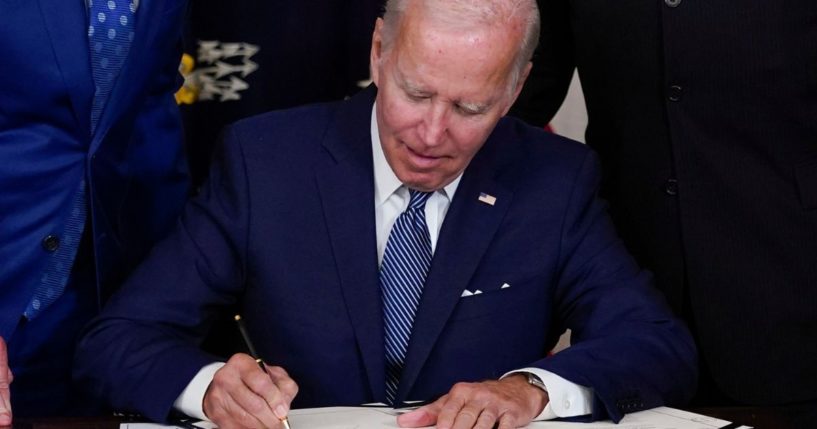 President Joe Biden signs the Inflation Reduction Act in Washington, D.C., on Tuesday.