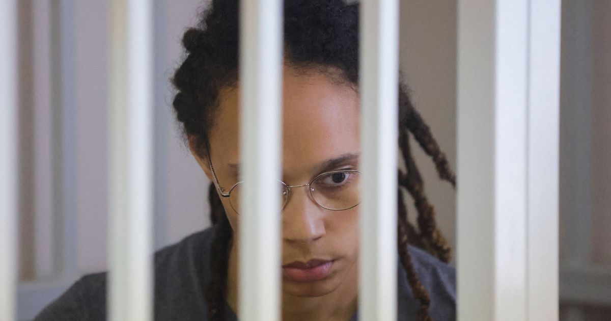 U.S. basketball player Brittney Griner, who was detained at Moscow's Sheremetyevo airport and later charged with illegal possession of cannabis, waits for the verdict inside a defendants' cage during a hearing in Khimki outside Moscow on Thursday.