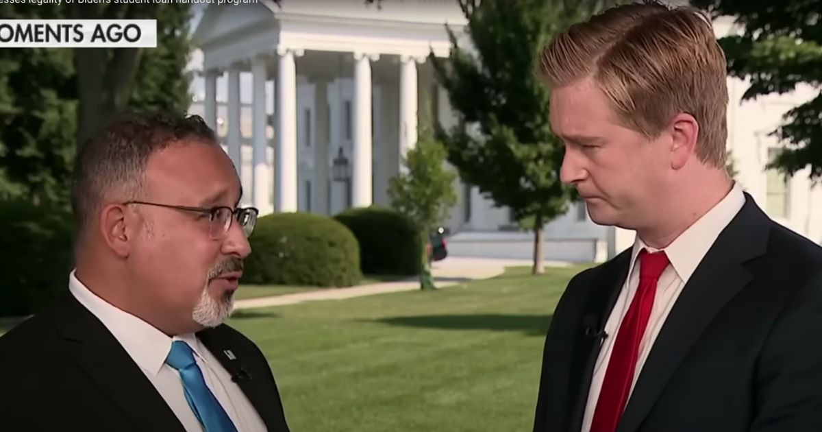 Fox News White House correspondent Peter Doocy, right, interviews Education Secretary Miguel Cardona about the Biden administration's student debt forgiveness.