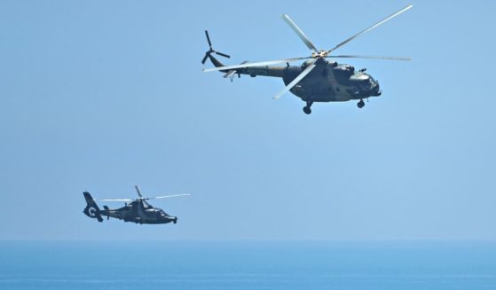 Chinese military helicopters fly past Pingtan island, one of mainland China's closest points from Taiwan, on Thursday ahead of massive military drills off Taiwan following House Speaker Nancy Pelosi's visit to the self-ruled island.