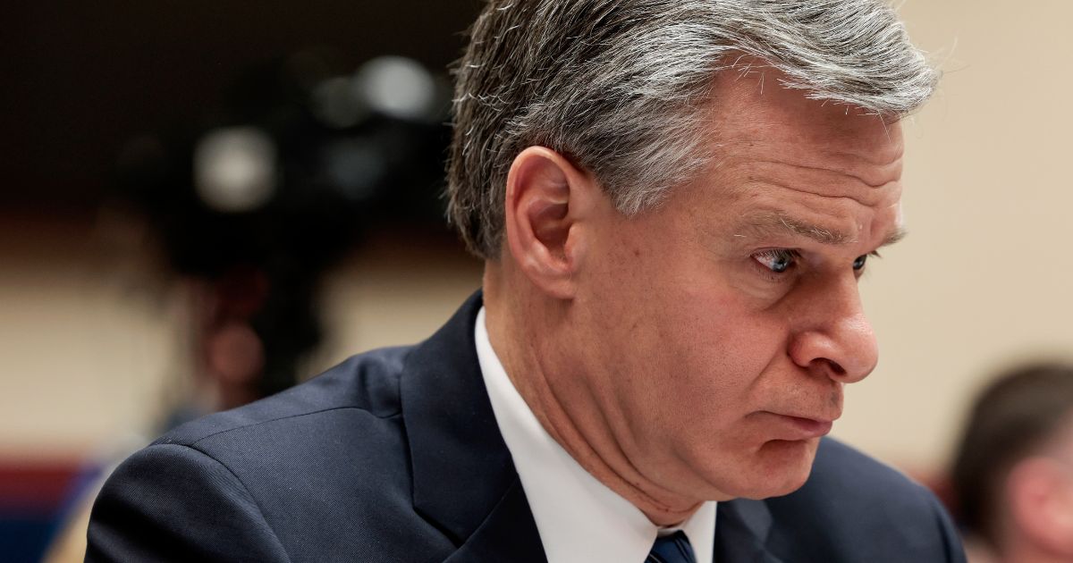 FBI Director Christopher Wray listens during a House Intelligence Committee hearing in the Rayburn House Office Building in Washington on March 8.