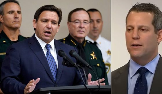 Florida Gov. Ron DeSantis, left, is surrounded by law enforcement officials as he speaks during a news conference Thursday about the suspension of Hillsborough State Attorney Andrew Warren, right.