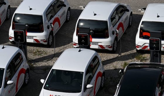 Electric vehicles are parked at charging stations in Nuremberg, Germany, on Tuesday.