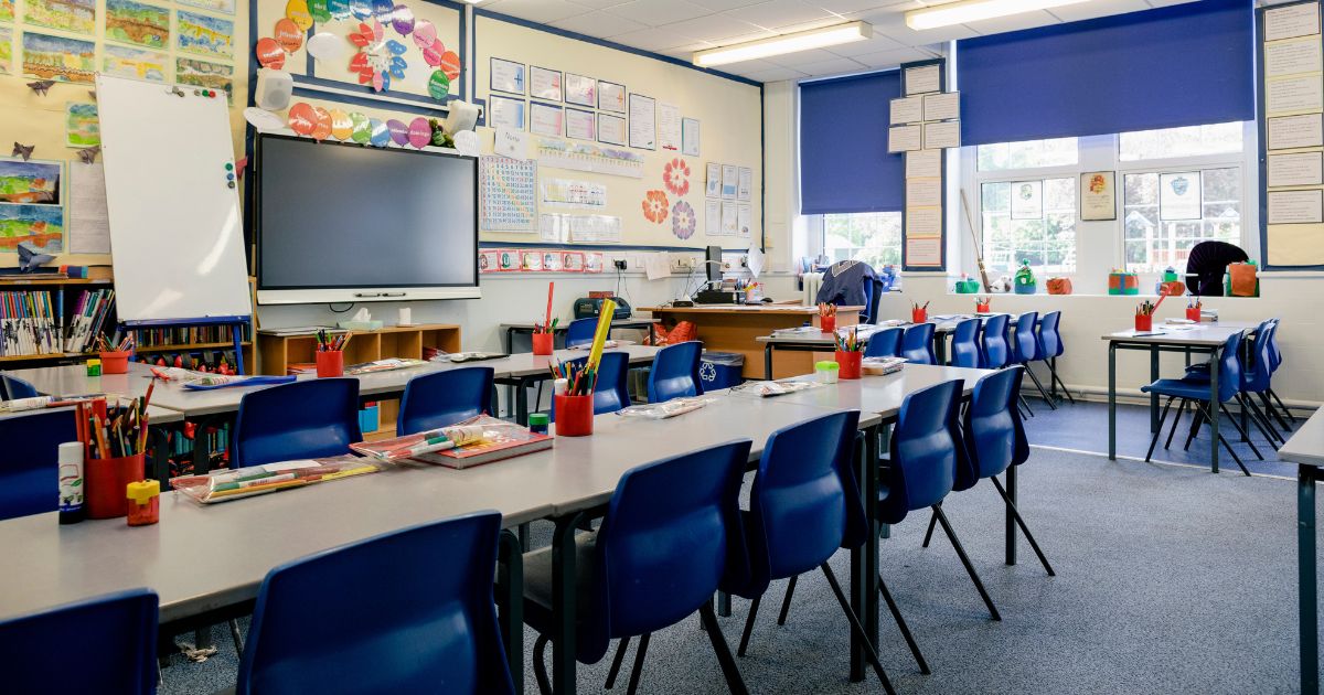 An elementary classroom is pictured in this stock photo.