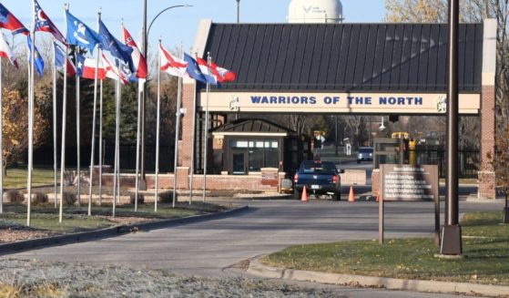 State flags lead up to the main gate of Grand Forks Air Force Base, North Dakota, in a file photo from October 2019.
