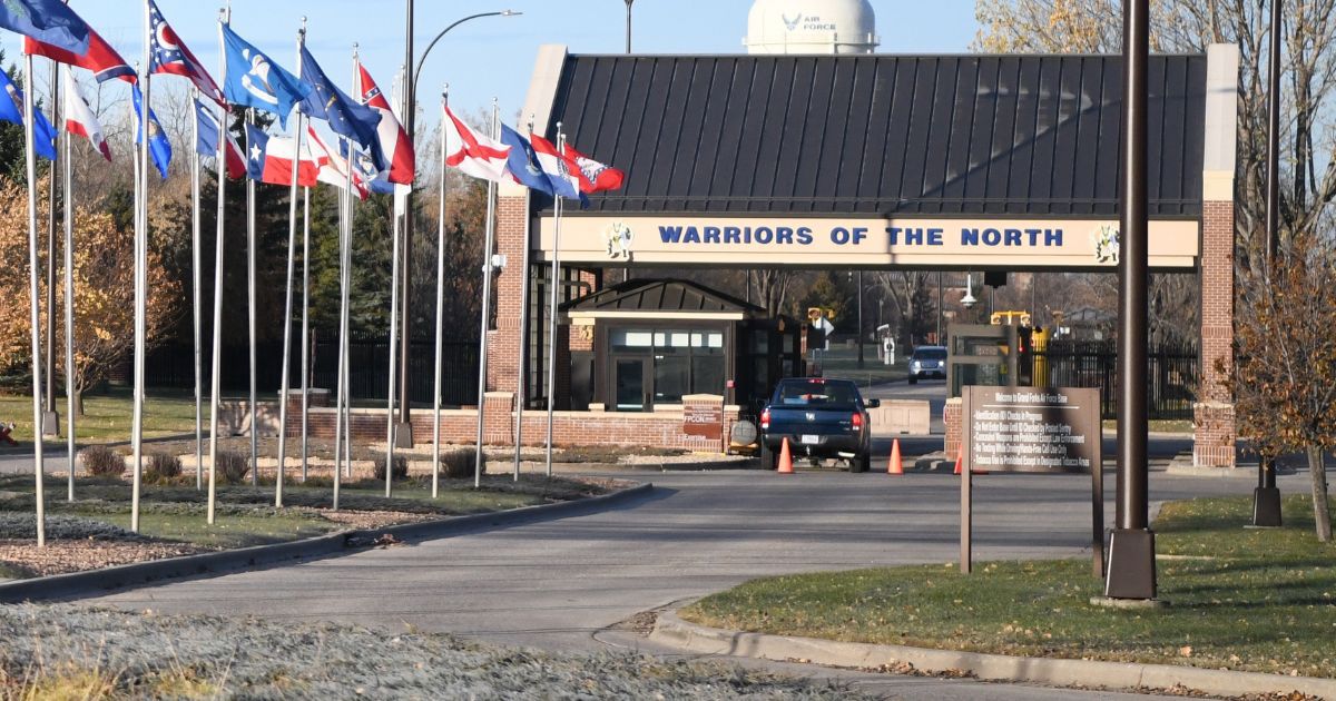 State flags lead up to the main gate of Grand Forks Air Force Base, North Dakota, in a file photo from October 2019.