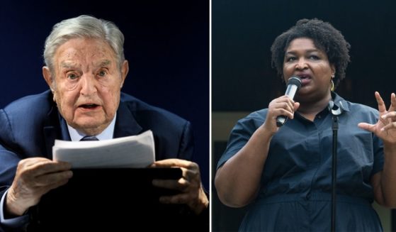 George Soros, left, speaks during the World Economic Forum's annual meeting in Davos, Switzerland, on May 24. Georgia gubernatorial candidate Stacey Abrams speaks on July 28 in Clayton, Georgia.