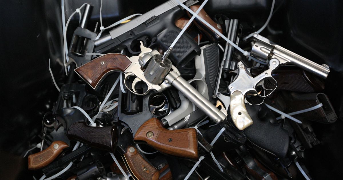 Several surrendered handguns are pictured in a bin during a gun buyback event in Los Angeles, California, on May 31, 2014.