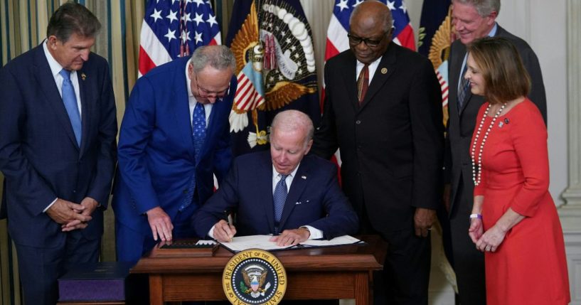 President Joe Biden signs the Inflation Reduction Act into law in the State Dining Room of the White House in Washington, D.C., on Tuesday.
